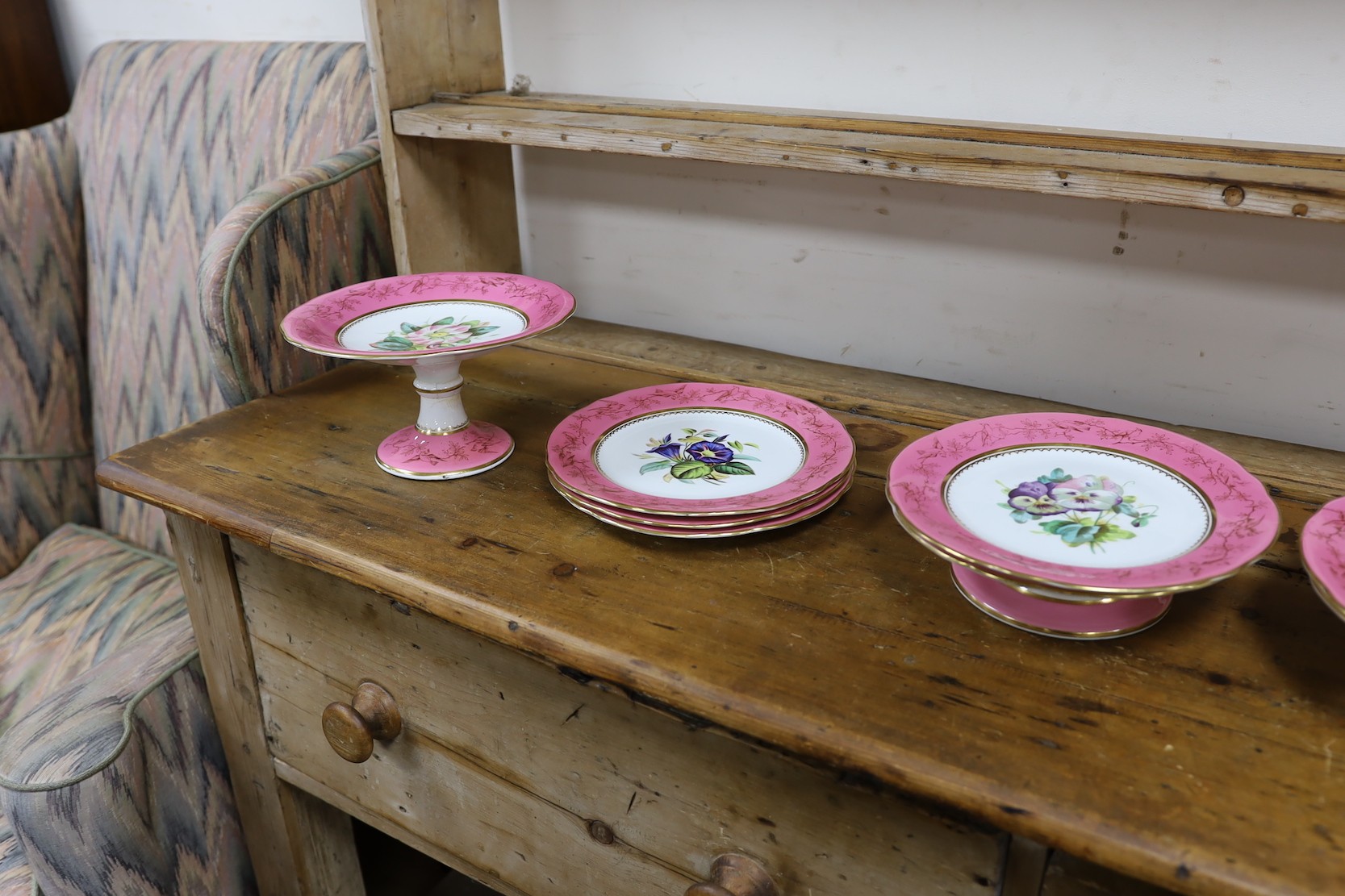 An English porcelain pink ground floral dessert service, late 19th century